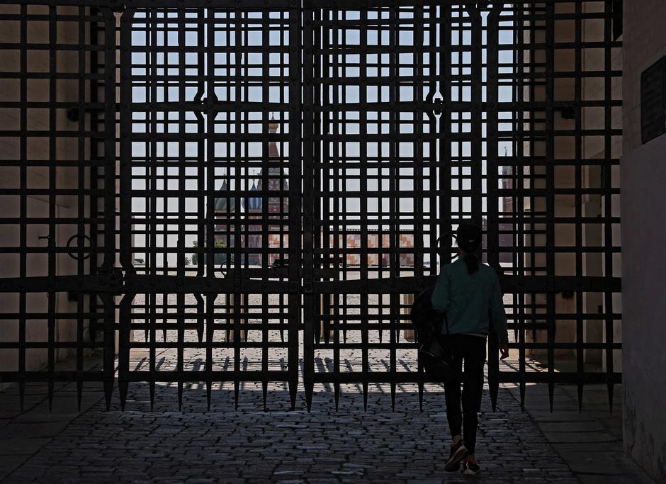 A woman walks near the closed Red Square in Moscow