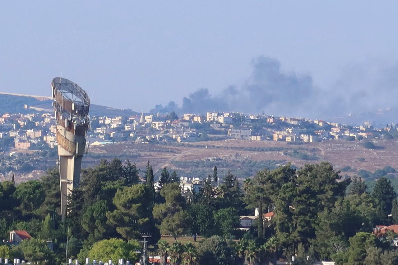 FILE PHOTO: Smoke rises above Lebanon, amid cross-border hostilities between Hezbollah and Israeli forces, as seen from northern Israel