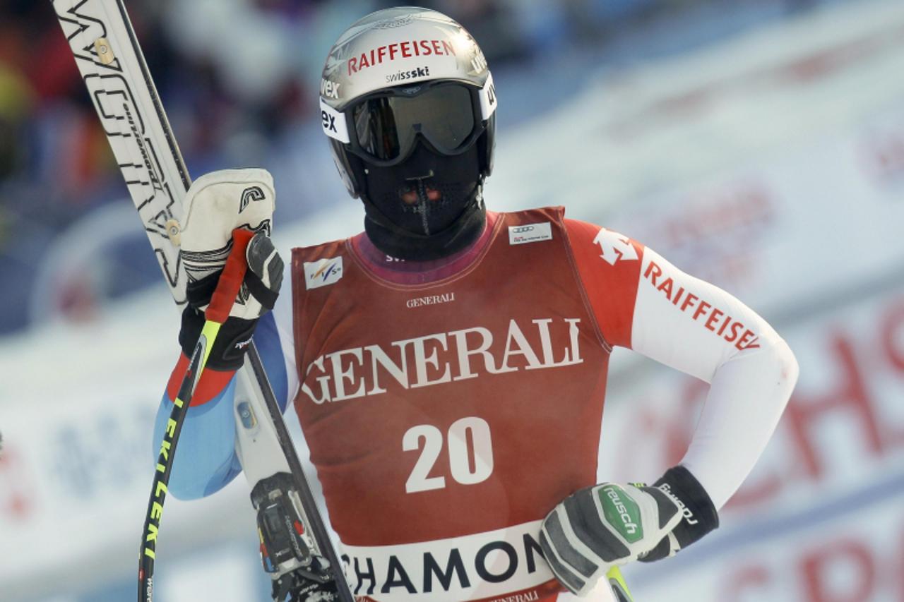 \'Beat Feuz of Switzerland looks on after the Men\'s World Cup Super Combined Downhill skiing race in Les Houches near Chamonix, French Alps, February 5, 2012. REUTERS/Robert Pratta (FRANCE - Tags: SP