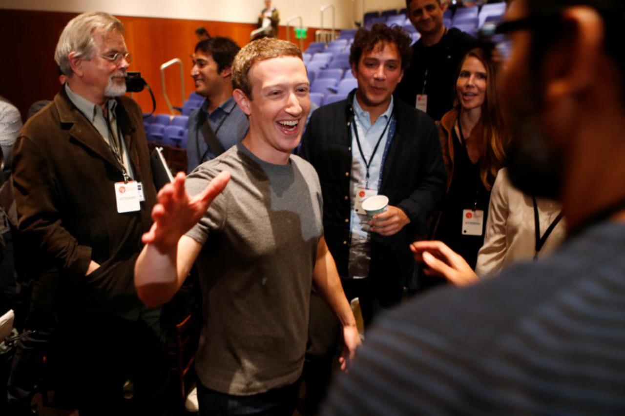 Mark Zuckerberg greets attendees after announcing the Chan Zuckerberg Initiative to 