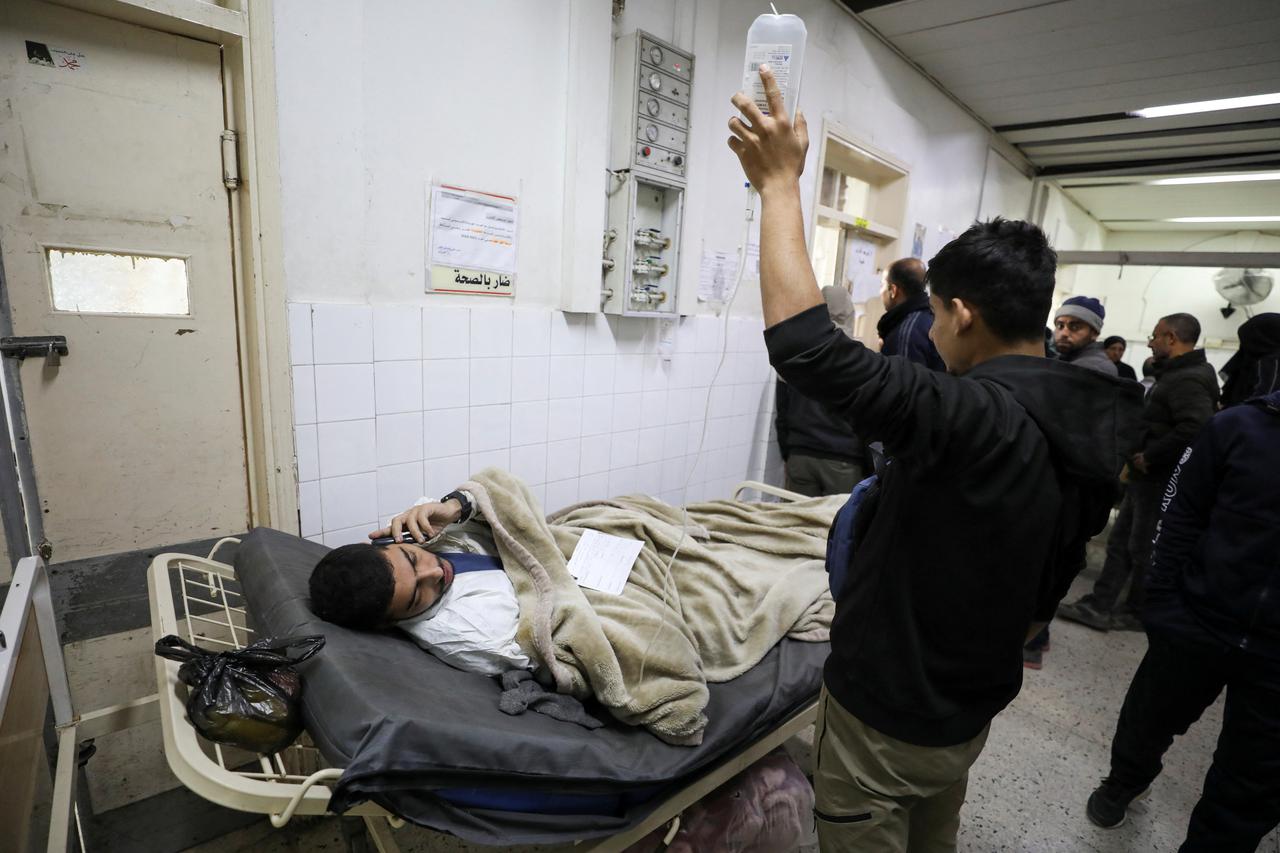 Wounded Palestinians arrive at Al-Ahli al-Arabi hospital, in Gaza City