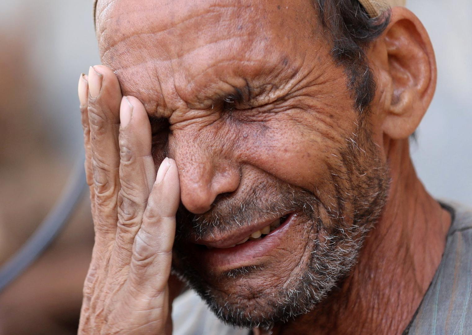 Hassan El Salheen, weeps after burying the repatriated body of his son, Aly, who died along with his three cousins in Libya after Storm Daniel hit the country, at Al Sharief village in Bani Swief province, Egypt September 13, 2023. REUTERS/Mohamed Abd El Ghany Photo: MOHAMED ABD EL GHANY/REUTERS