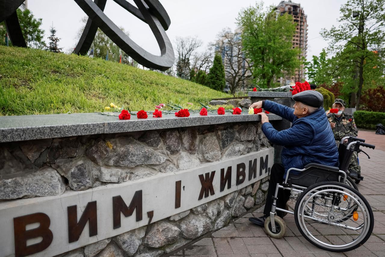 People attend a ceremony marking the anniversary of the Chernobyl nuclear disaster in Kyiv