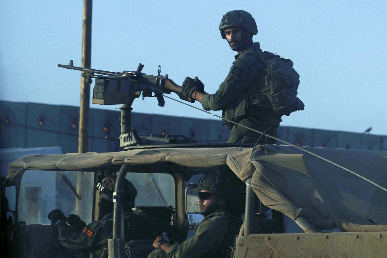 Israeli military stands near the Israel-Gaza border, amid the Israel-Hamas conflict