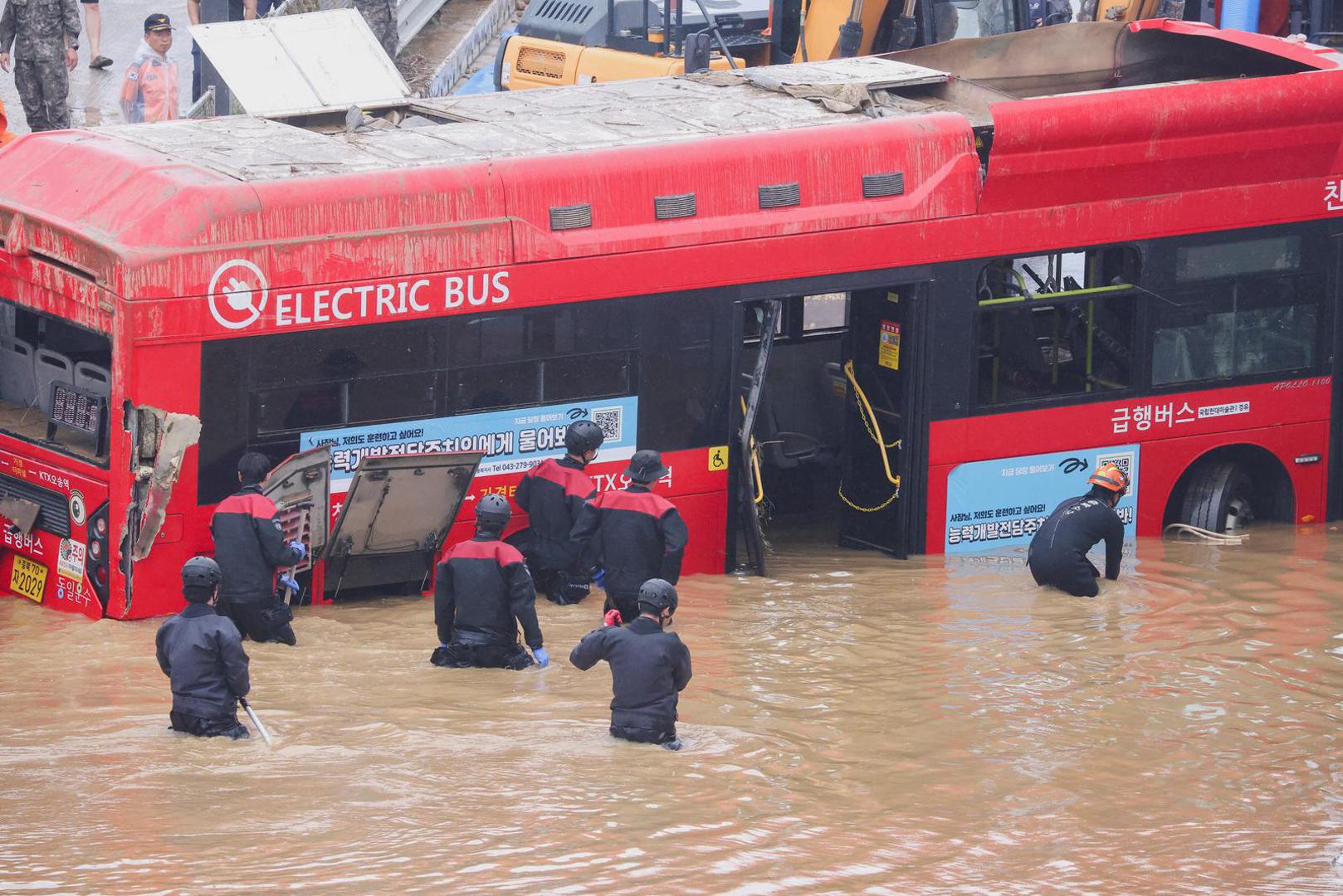 Rescue workers take part in a search and rescue operation near an underpass that has been submerged by a flooded river caused by torrential rain in Cheongju, South Korea, July 16, 2023.   REUTERS/Kim Hong-ji Photo: KIM HONG-JI/REUTERS