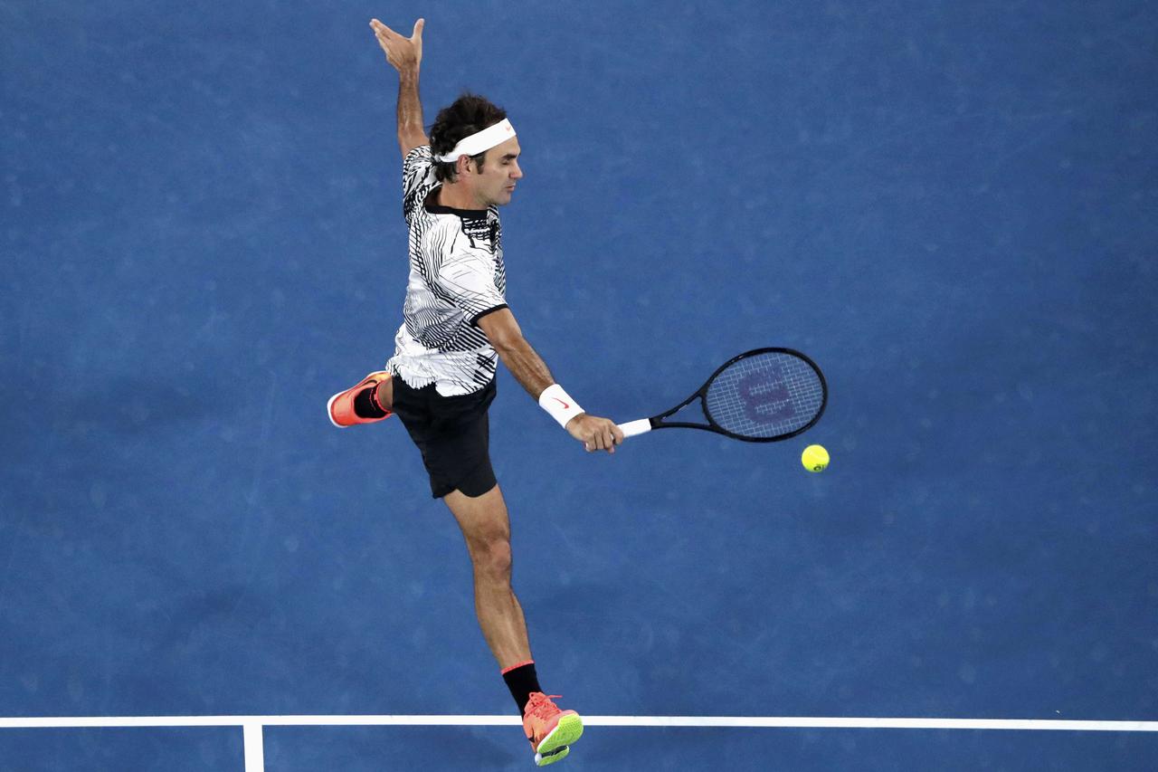 Tennis - Australian Open - Melbourne Park, Melbourne, Australia - 26/1/17 Switzerland's Roger Federer hits a shot during his Men's singles semi-final match against Switzerland's Stan Wawrinka. REUTERS/Jason Reed