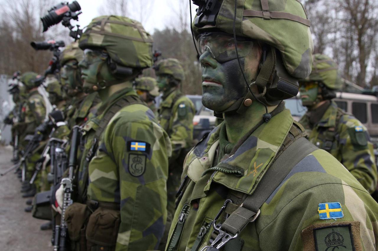 Swedish troops from the Life Guards take part in a training at a military site in Kungsangen