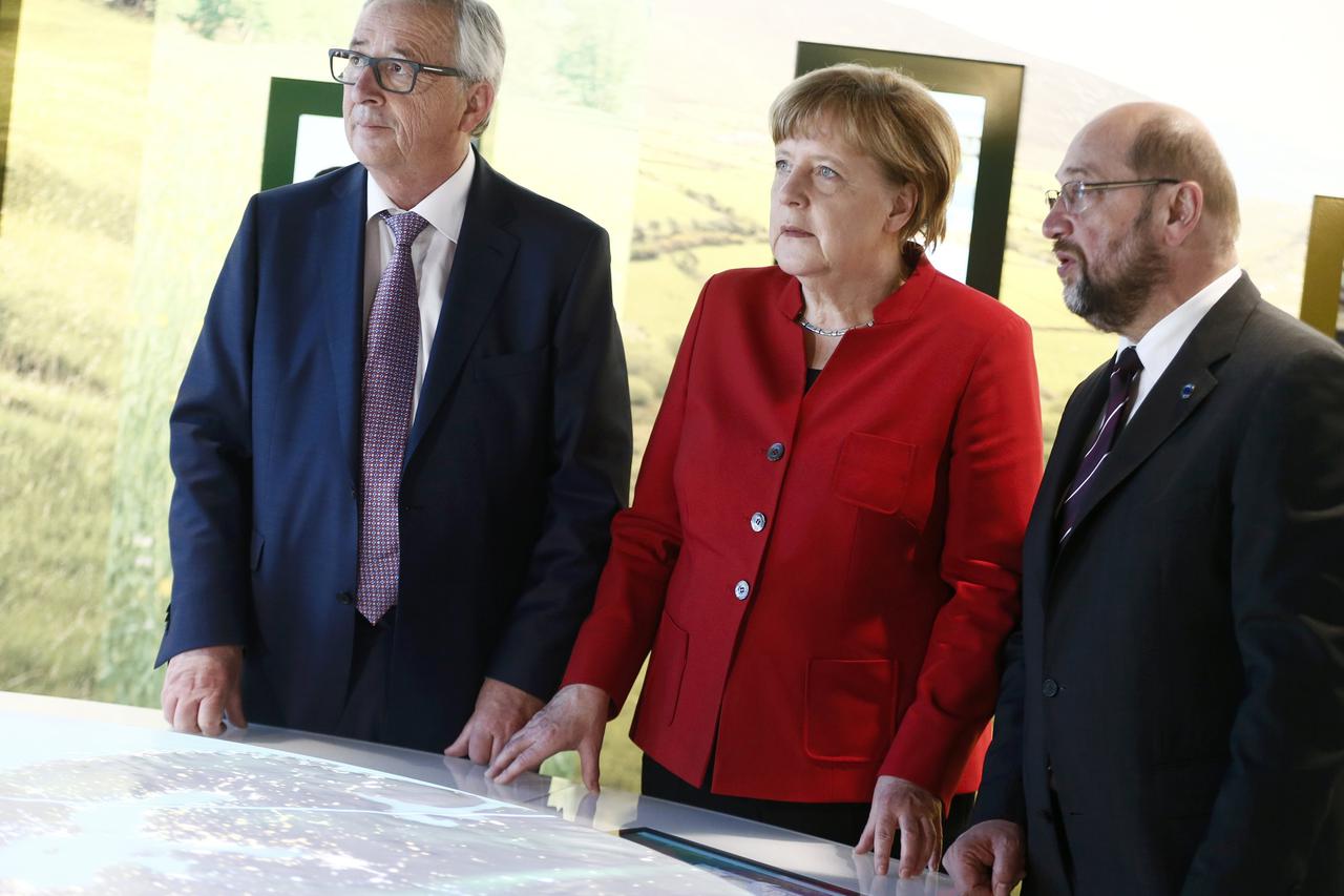 German Chancellor Merkel, European Commission President Juncker and European Parliament President Schulz tour the Europa Experience exhibition in the European House in Berlin German Chancellor Angela Merkel, European Commission President Jean-Claude Junck