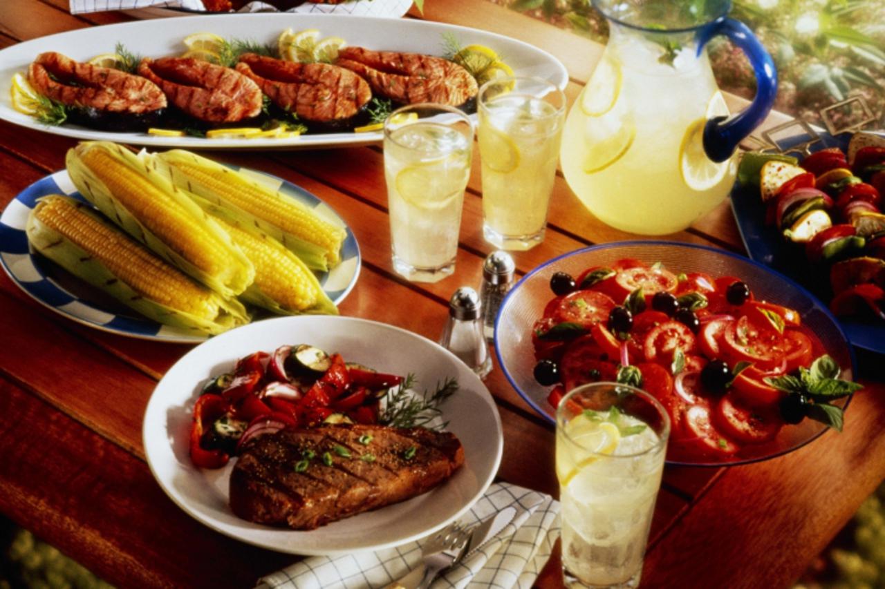 'Barbecue spread on picnic table'