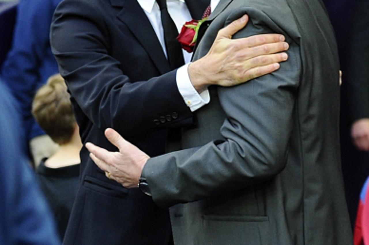 \'Barcelona\'s Spanish coach Josep Guardiola (L) embraces Manchester United manager Alex Ferguson during the UEFA Champions League final football match FC Barcelona vs. Manchester United, on May 28, 2