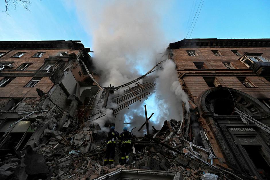 FILE PHOTO: Rescuers work at a residential building which was heavily damaged by a Russian missile strike in Zaporizhzhia