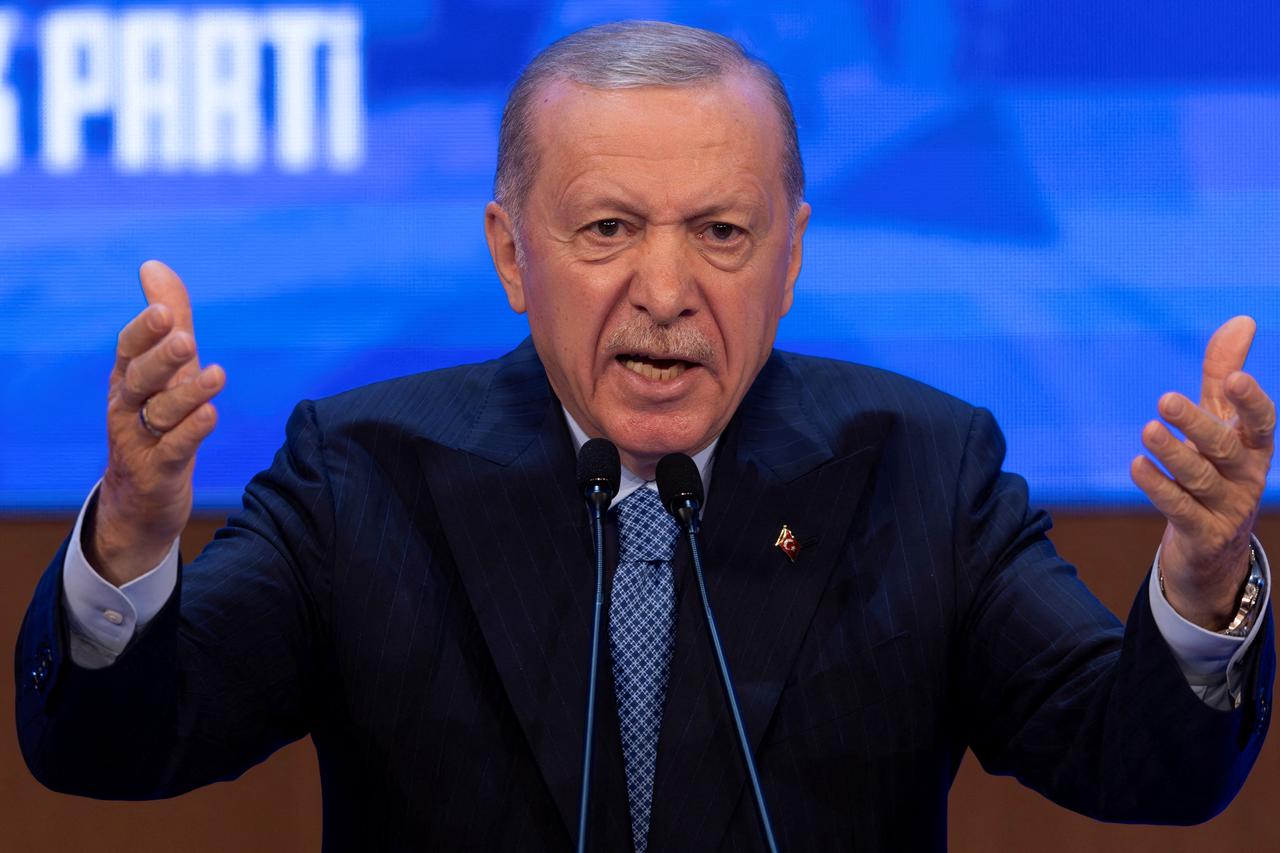 FILE PHOTO: Turkish President Tayyip Erdogan addresses his supporters during a meeting in Ankara