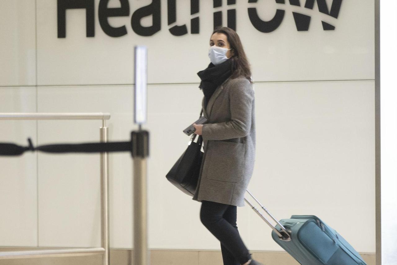 Passengers from Lisbon arrive back at Heathrow