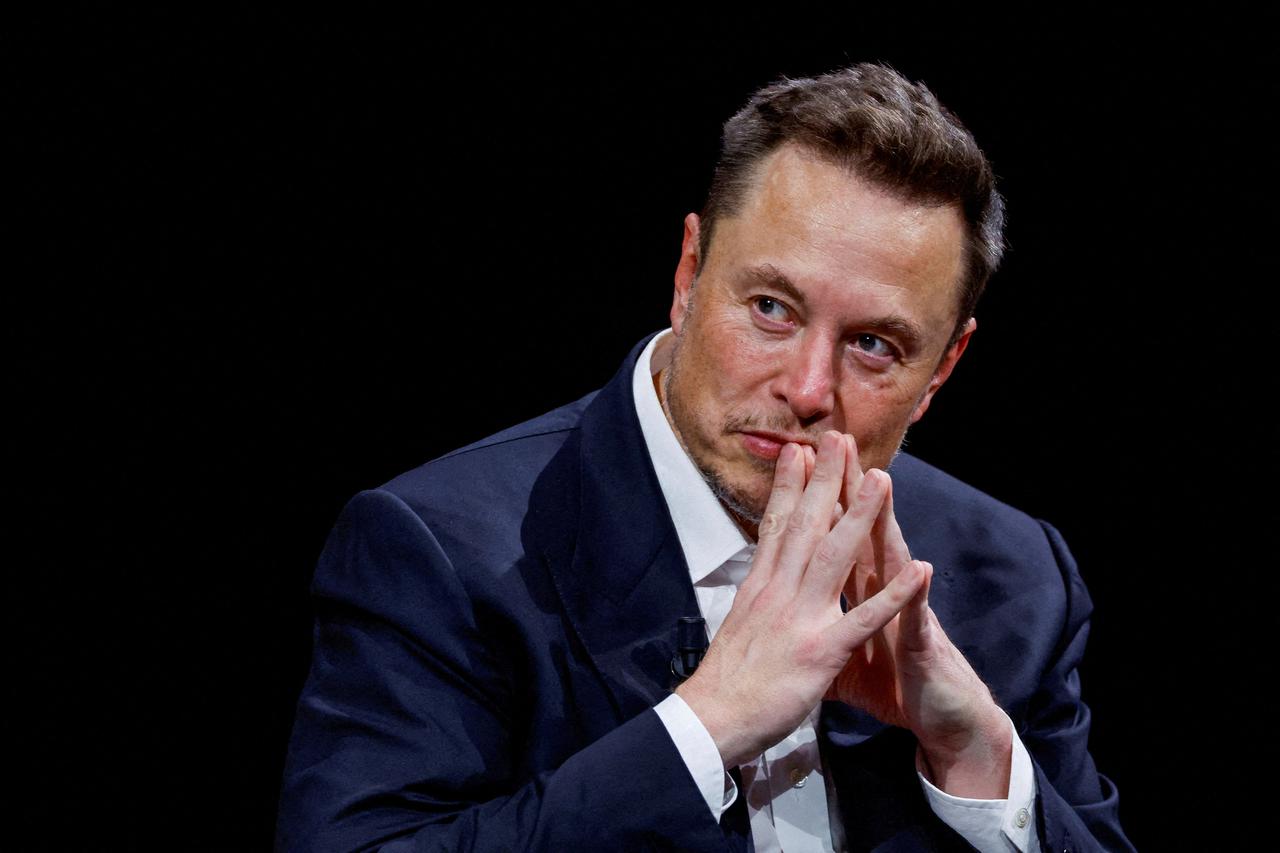 FILE PHOTO: Elon Musk, owner of X, formerly Twitter, gestures as he attends a conference in Paris in June 2023. REUTERS/Gonzalo Fuentes/