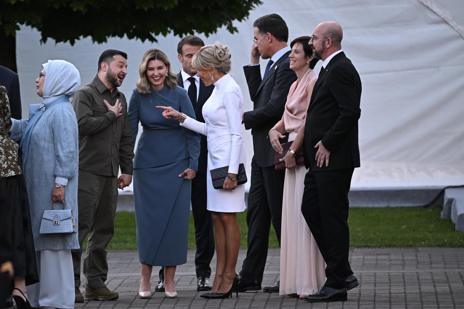 Ukrainian President Volodymyr Zelensky (2nd left) and his wife Olena Zelenska talk with French President Emmanuel Macron and his wife Brigitte Macron as they arrive for the social dinner during the Nato summit in Vilnius, Lithuania. Picture date: Tuesday July 11, 2023. Photo: PAUL ELLIS/PRESS ASSOCIATION