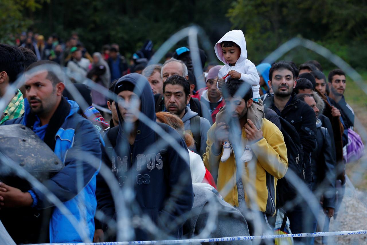 FILE PHOTO: Migrants make their way after crossing the border at Zakany, Hungary October 16, 2015. REUTERS/Laszlo Balogh/File Photo