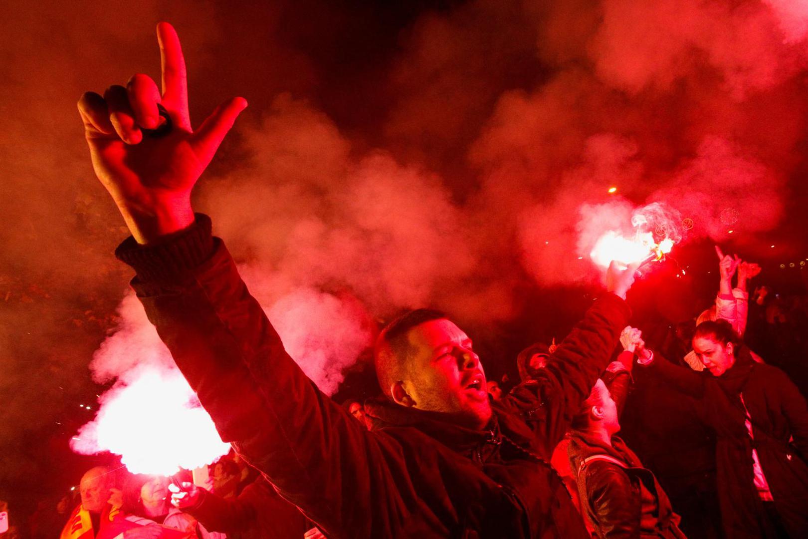 A protestor lights a flare during a protest against the adoption of a law to limit presidential powers in Podgorica, Montenegro, December 12, 2022. REUTERS/Stevo Vasiljevic Photo: STEVO VASILJEVIC/REUTERS