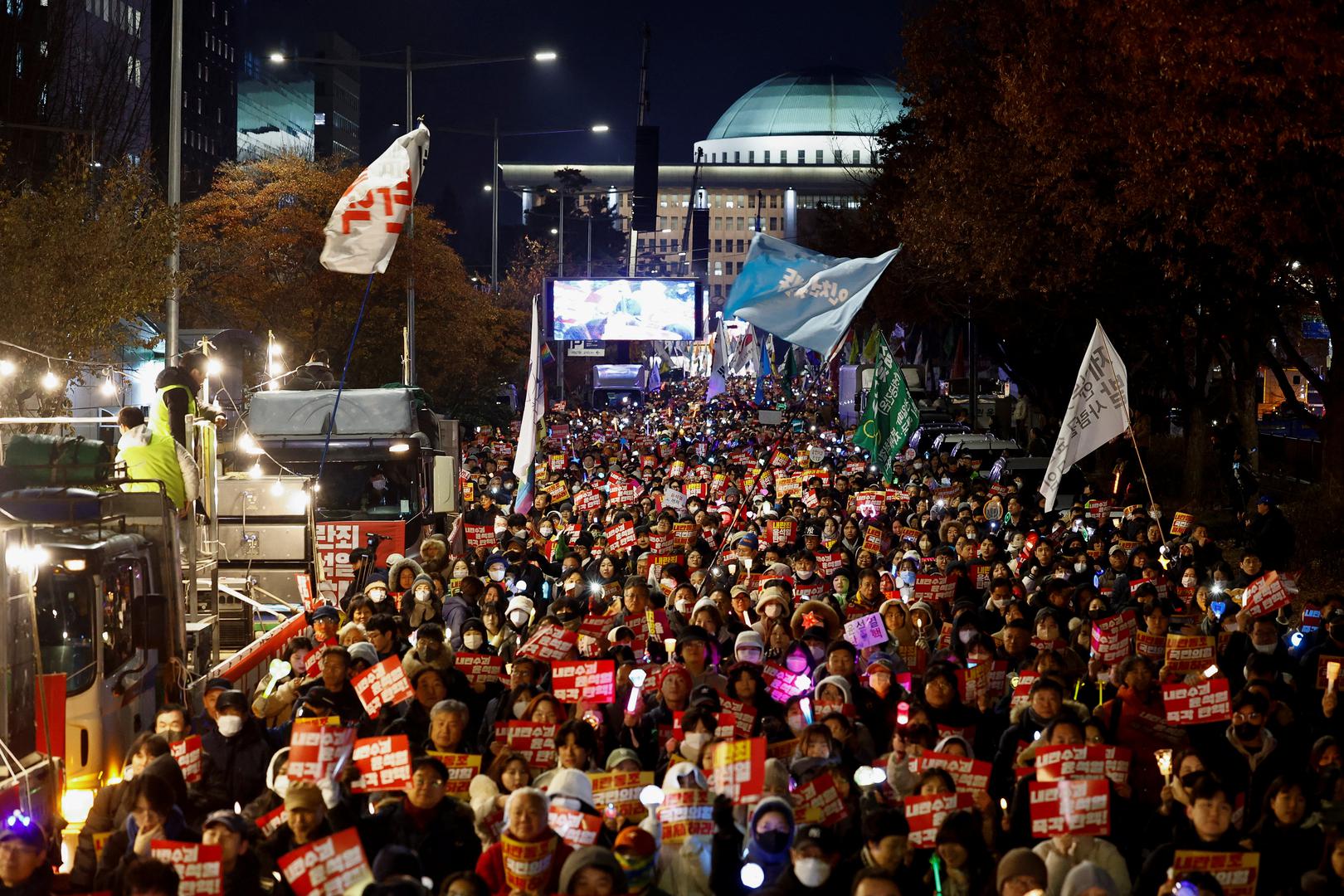 Protesters attend a rally calling for the impeachment of South Korean President Yoon Suk Yeol, who declared martial law, which was reversed hours later, in front of the National Assembly in Seoul, South Korea, December 9, 2024.  REUTERS/Kim Kyung-Hoon Photo: KIM KYUNG-HOON/REUTERS