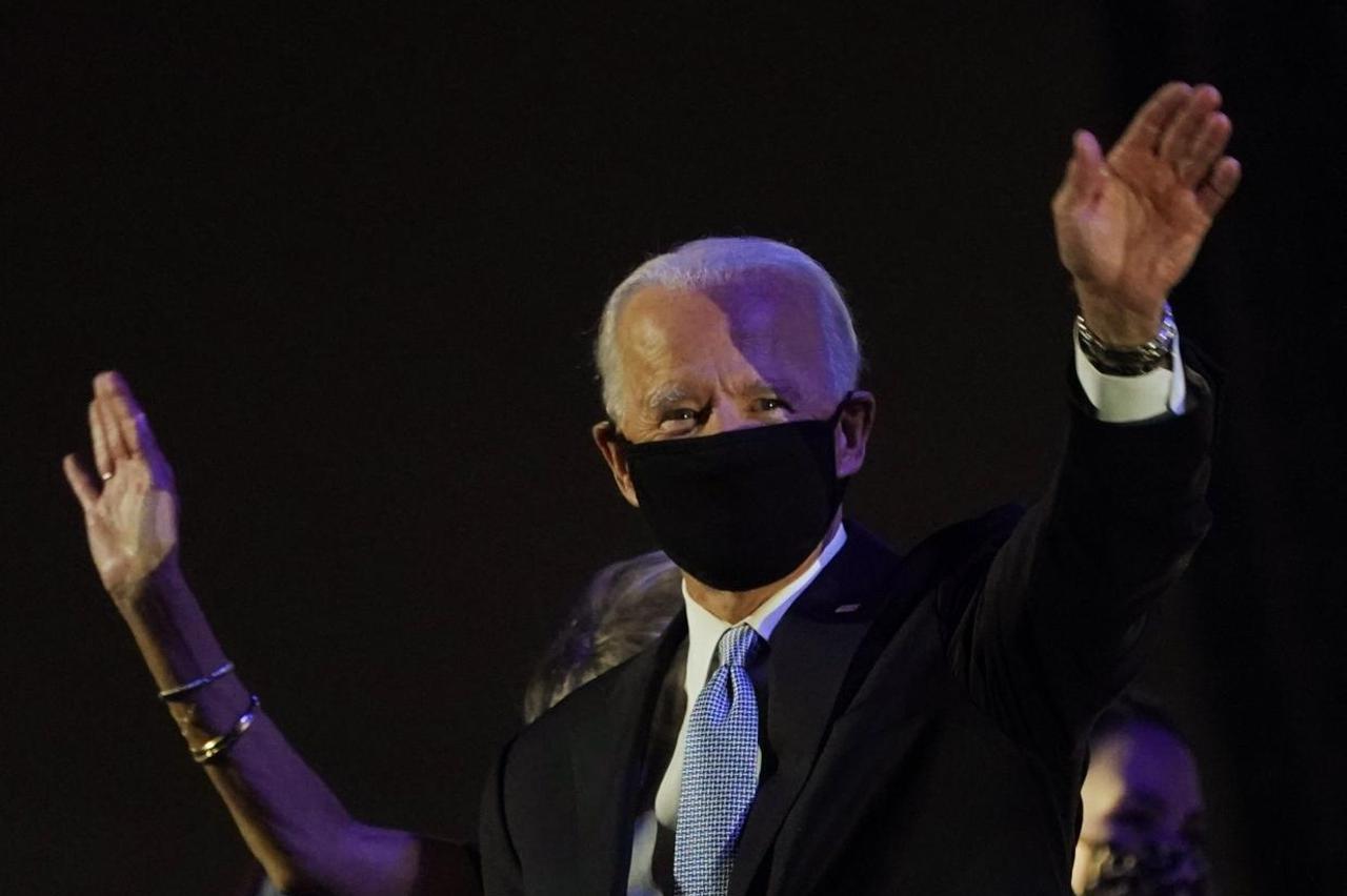 Democratic 2020 U.S. presidential nominee Joe Biden celebrates onstage at his election rally in Wilmington