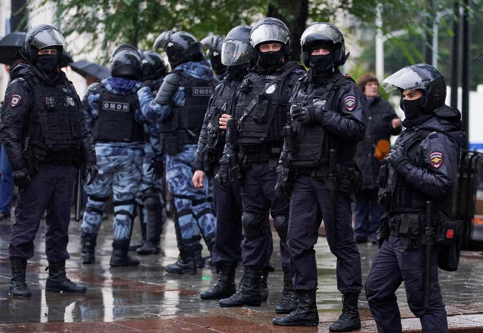 FILE PHOTO: Russian police officers stand guard during a rally in Moscow