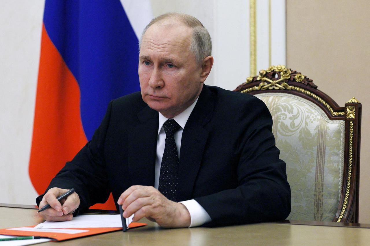 Russian President Vladimir Putin chairs a Security Council meeting in Moscow