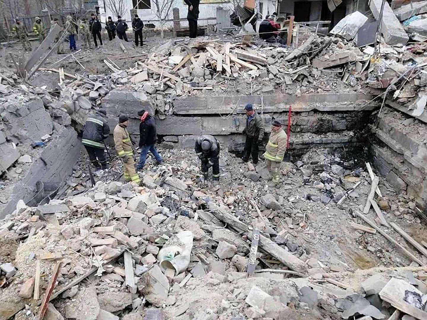 A Ukrainian rescue team and locals are seen among debris of residential buildings damaged by a shelling in the Zhytomyr region amid the Russian invasion of Ukraine on Monday, March 7, 2022. Photo by Ukrainian State Emergency Service/ UPI Photo via Newscom