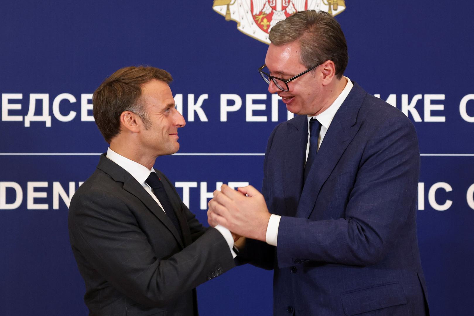 French President Emmanuel Macron and Serbian President Aleksandar Vucic shake hands following a joint press conference at the Palace of Serbia building in Belgrade, Serbia, August 29, 2024. REUTERS/Djordje Kojadinovic Photo: DJORDJE KOJADINOVIC/REUTERS