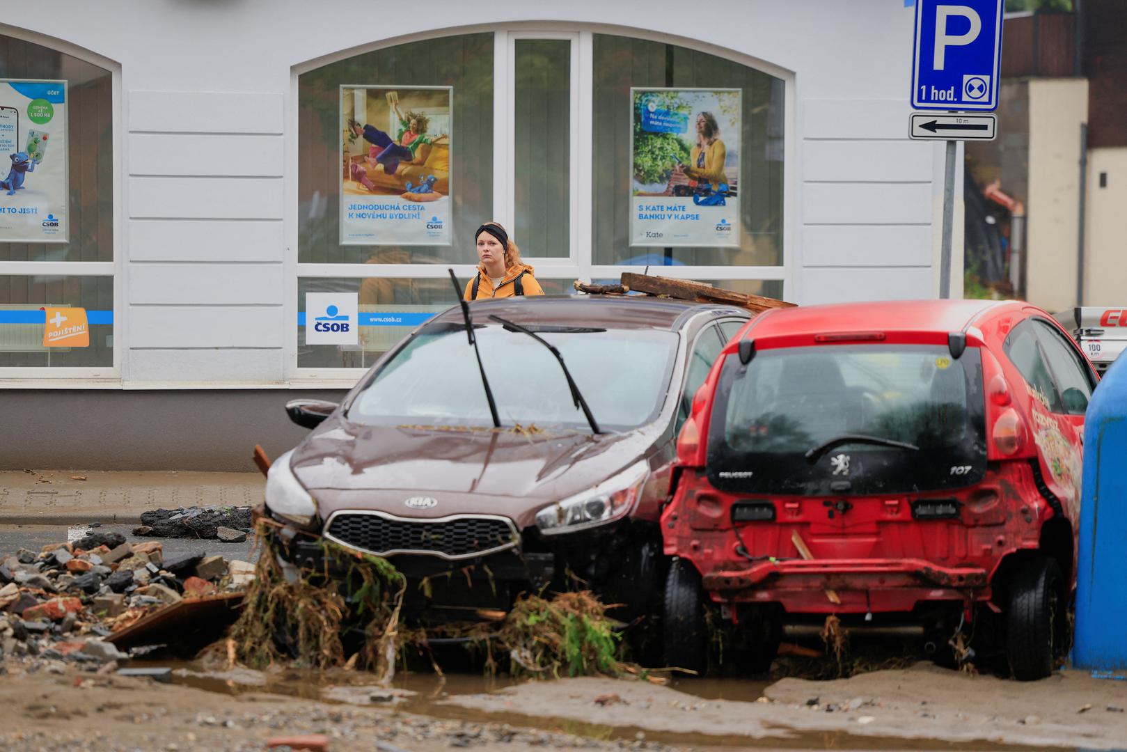 A woman looks at damaged vehicles, in the aftermath of flooding following heavy rainfalls, in Jesenik, Czech Republic, September 16, 2024. REUTERS/David W Cerny Photo: DAVID W CERNY/REUTERS