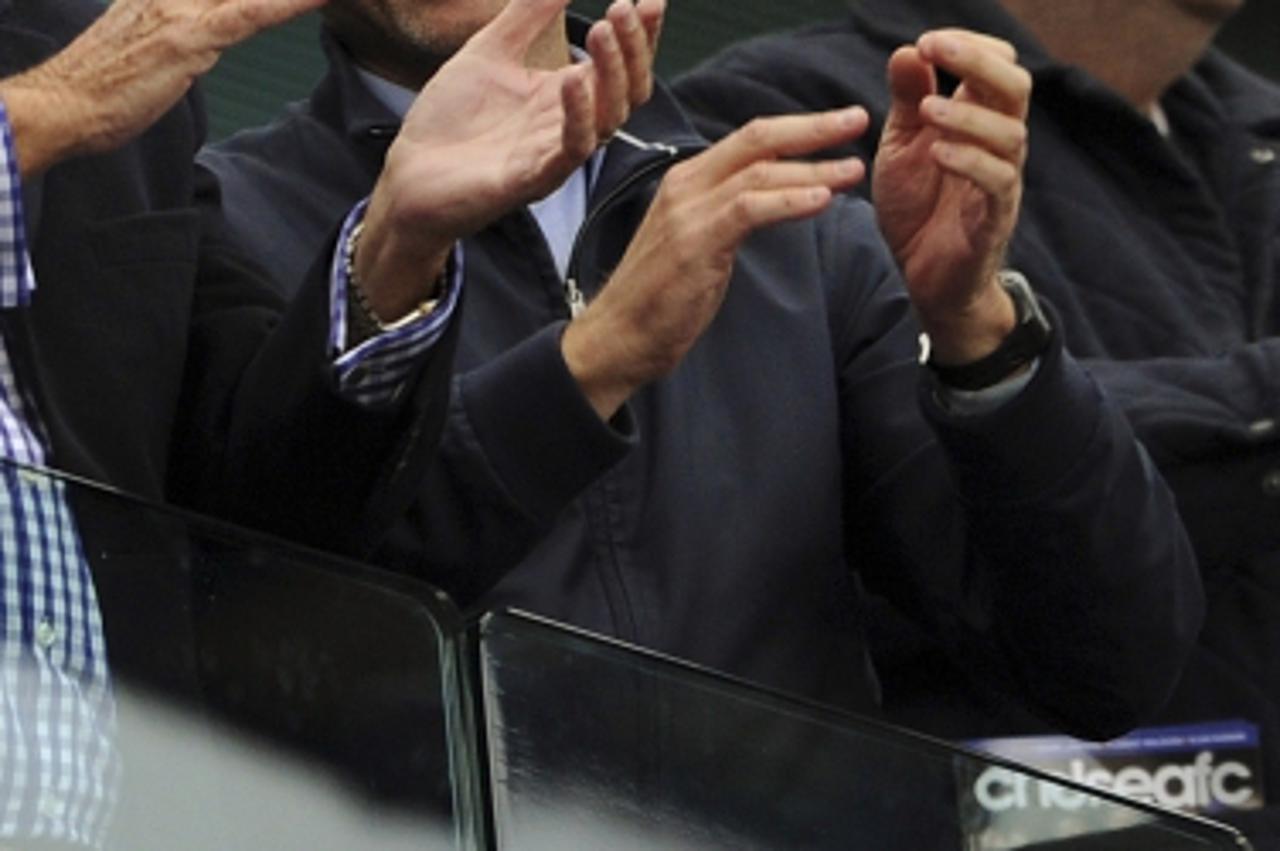 'Chelsea owner Roman Abramovich applauds after his team won the English Premier League at Stamford Bridge in London May 9, 2010.    REUTERS/Dylan Martinez  (BRITAIN - Tags: SPORT SOCCER) NO ONLINE/INT