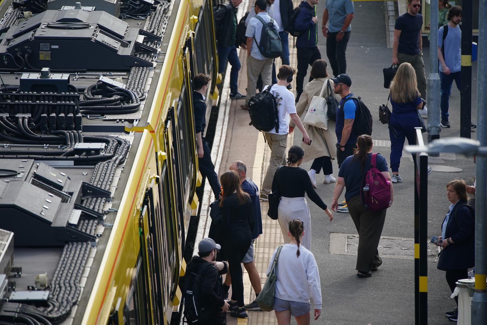 A general view of commuter disembarking a Great Northern railway train at Hunt's Cross station, Liverpool, amid reports of widespread IT outages affecting airlines, broadcasters and banks. Picture date: Friday July 19, 2024. Photo: Peter Byrne/PRESS ASSOCIATION