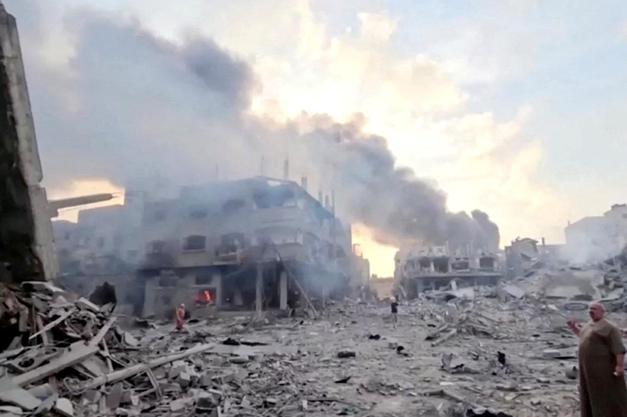 FILE PHOTO: Smoke billows over flattened buildings in Gaza's Jabalia camp