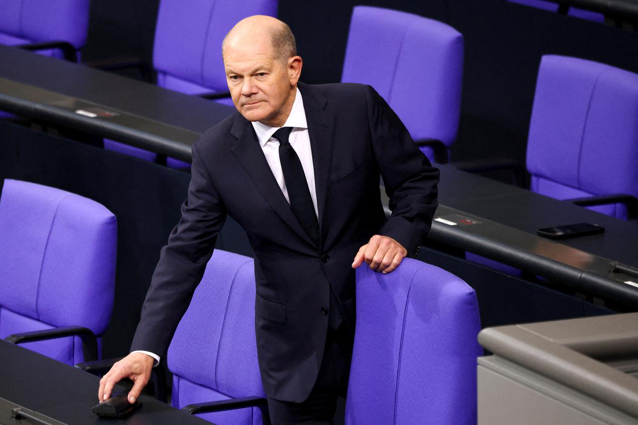 FILE PHOTO: German Chancellor Olaf Scholz reacts at the lower house of parliament