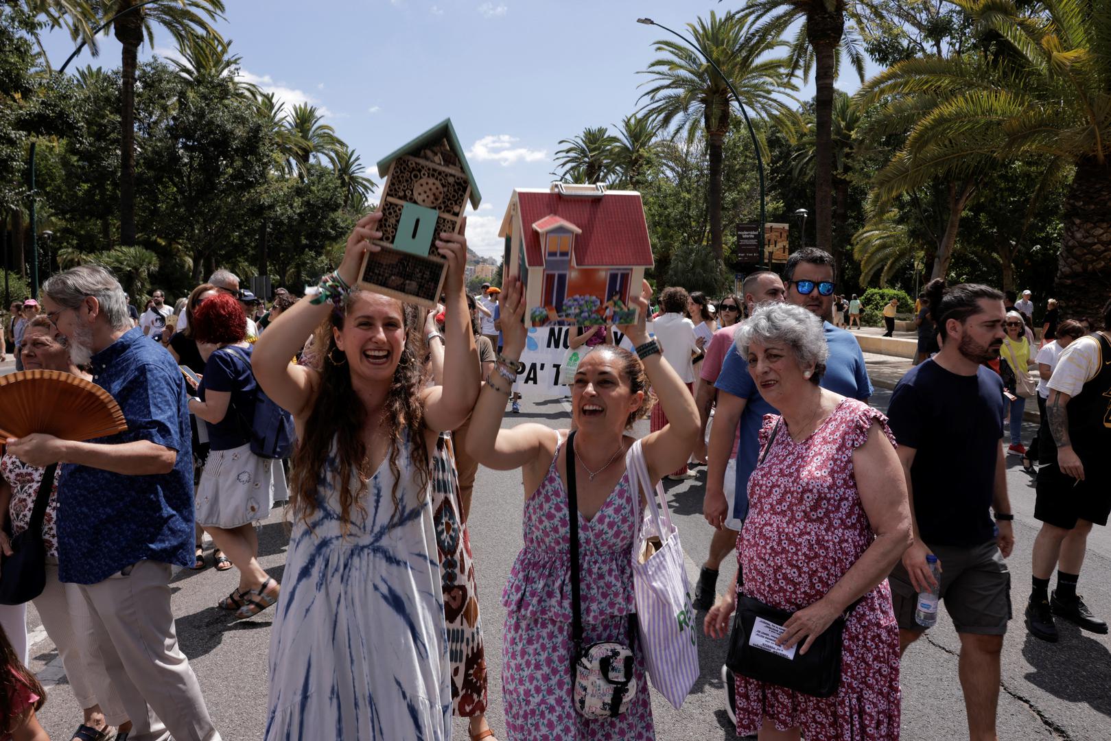 People take part in a demonstration against mass tourism, under the motto "Malaga to live, not to survive" in reaction to real estate high prices, driven by the increase of tourist accommodations, in Malaga, Spain, June 29, 2024. REUTERS/Jon Nazca Photo: JON NAZCA/REUTERS