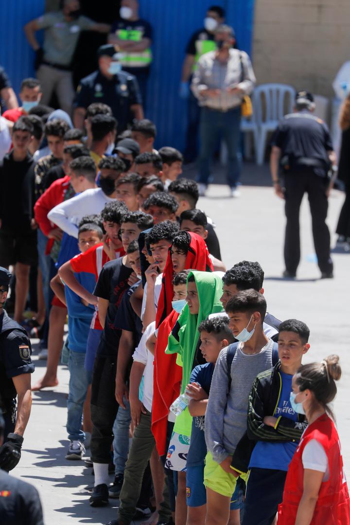 FILE PHOTO: Thousands of migrants cross the Spanish-Moroccan border FILE PHOTO: Moroccan minors queue at a facility prepared for them to rest and have food, after thousands of migrants swam across the Spanish-Moroccan border, in Ceuta, Spain, May 19, 2021. REUTERS/Jon Nazca/File Photo JON NAZCA