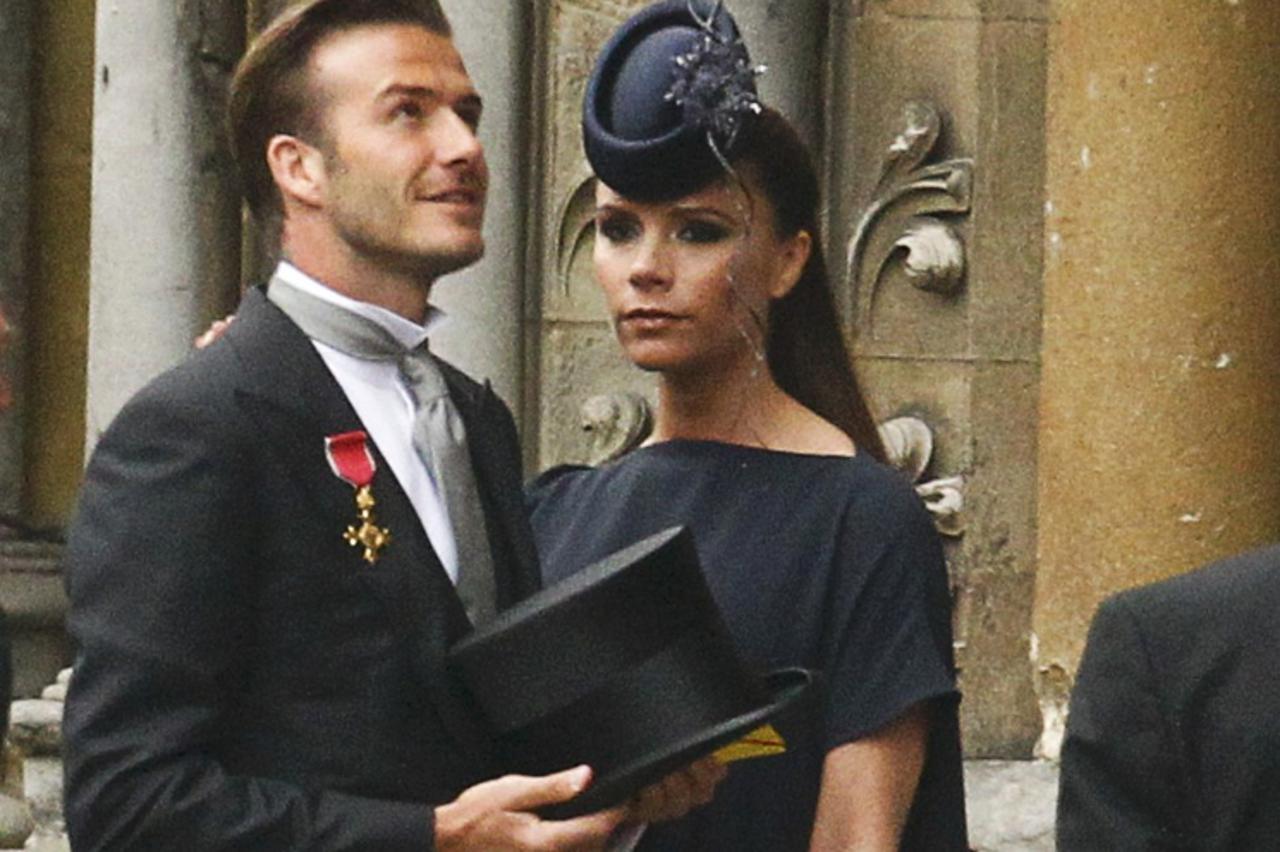 'Soccer star David Beckham and his wife Victoria arrive at Westminster Abbey before the wedding of Britain\'s Prince William and Kate Middleton, in central London April 29, 2011.   (ROYAL WEDDING/VIP)