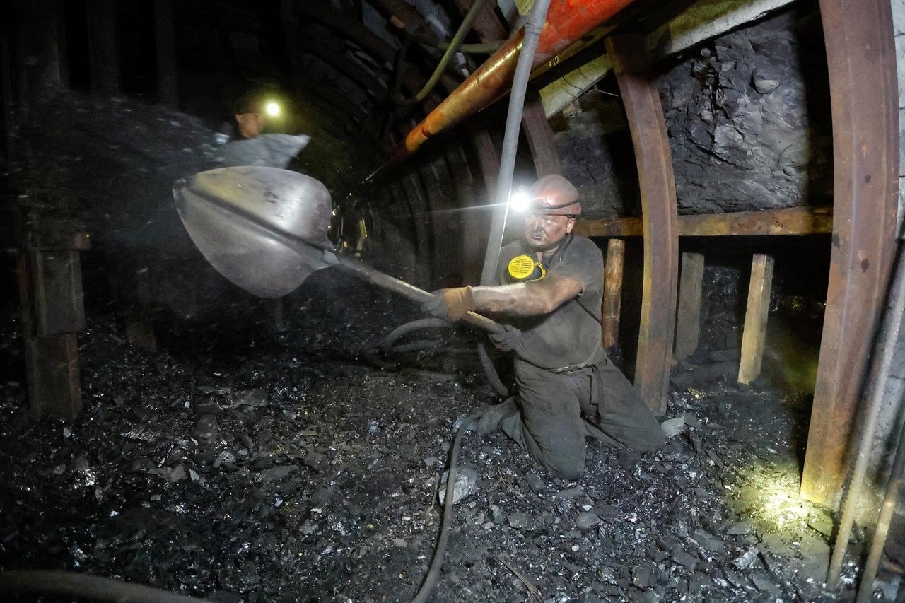 Miners work at a coal mine in Donetsk region