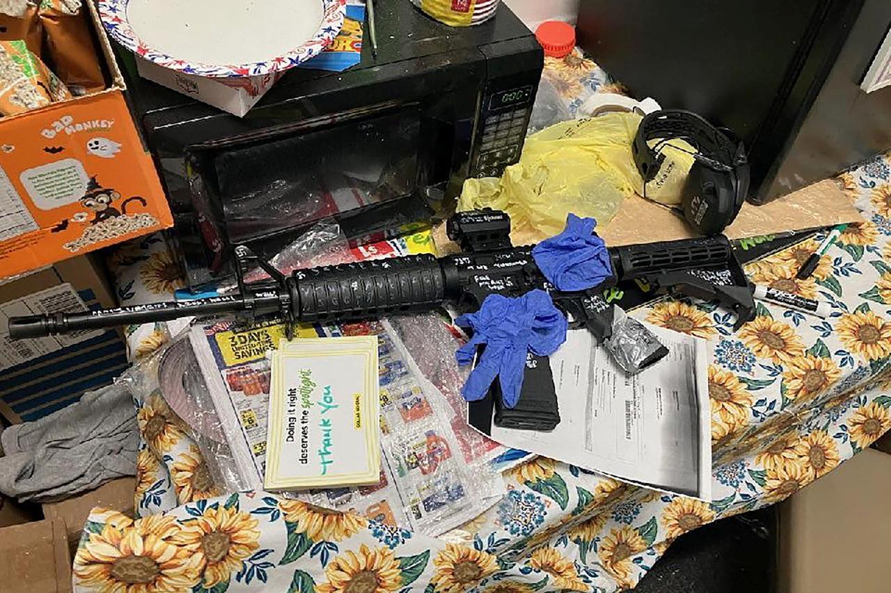 A recovered rifle lies on a table after a shooting at a Dollar General store in Jacksonville