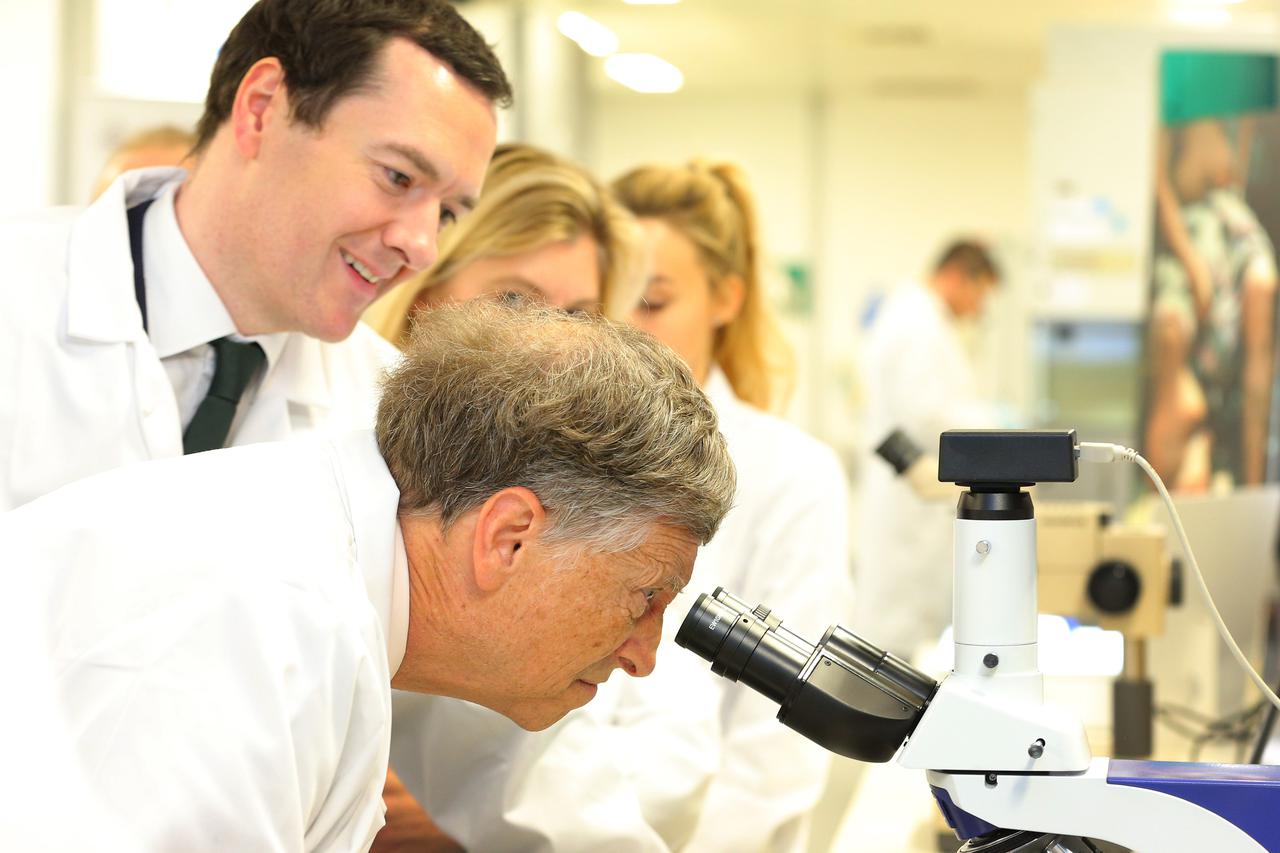 Malaria eventChancellor of the Exchequer George Osborne (second left) looks on as co-founder of Microsoft Bill Gates looks through a microscope during a visit to the Liverpool School of Tropical Medicine in Liverpool, as they join forces to fight malaria.