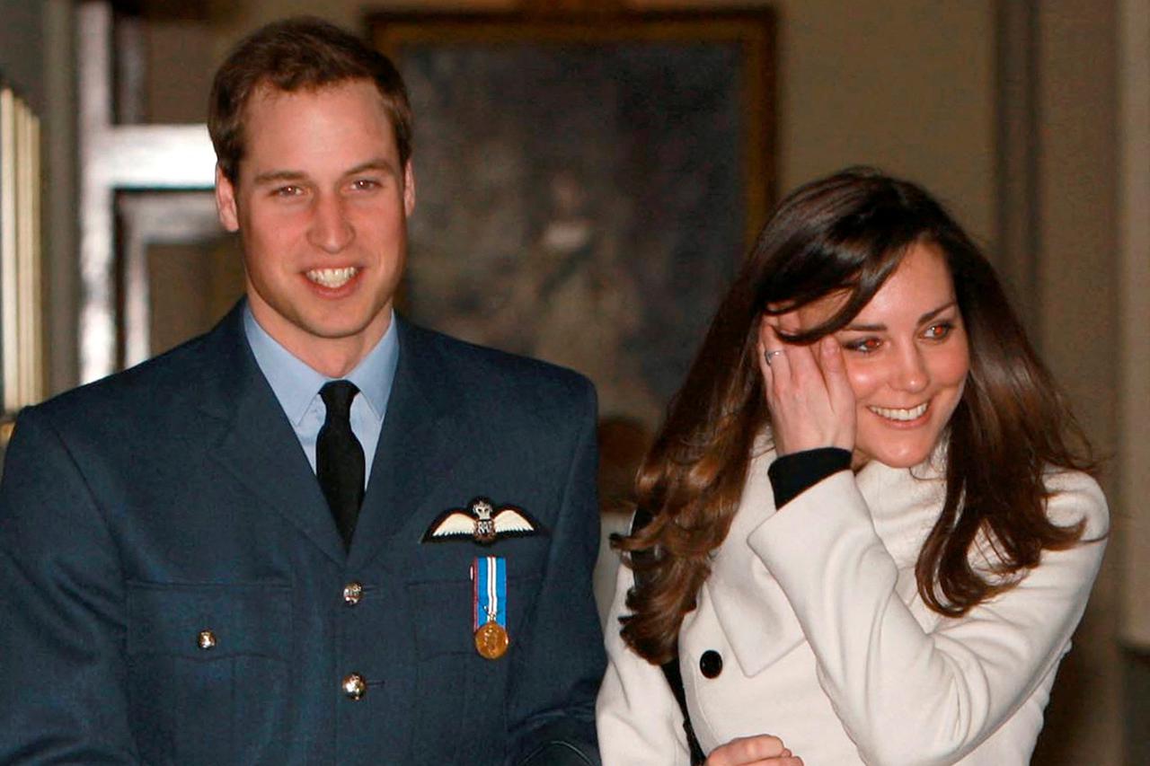 FILE PHOTO: File photograph shows Britain's Prince William smilling as he walks with his girlfriend Kate Middleton at RAF Cranwell, central England