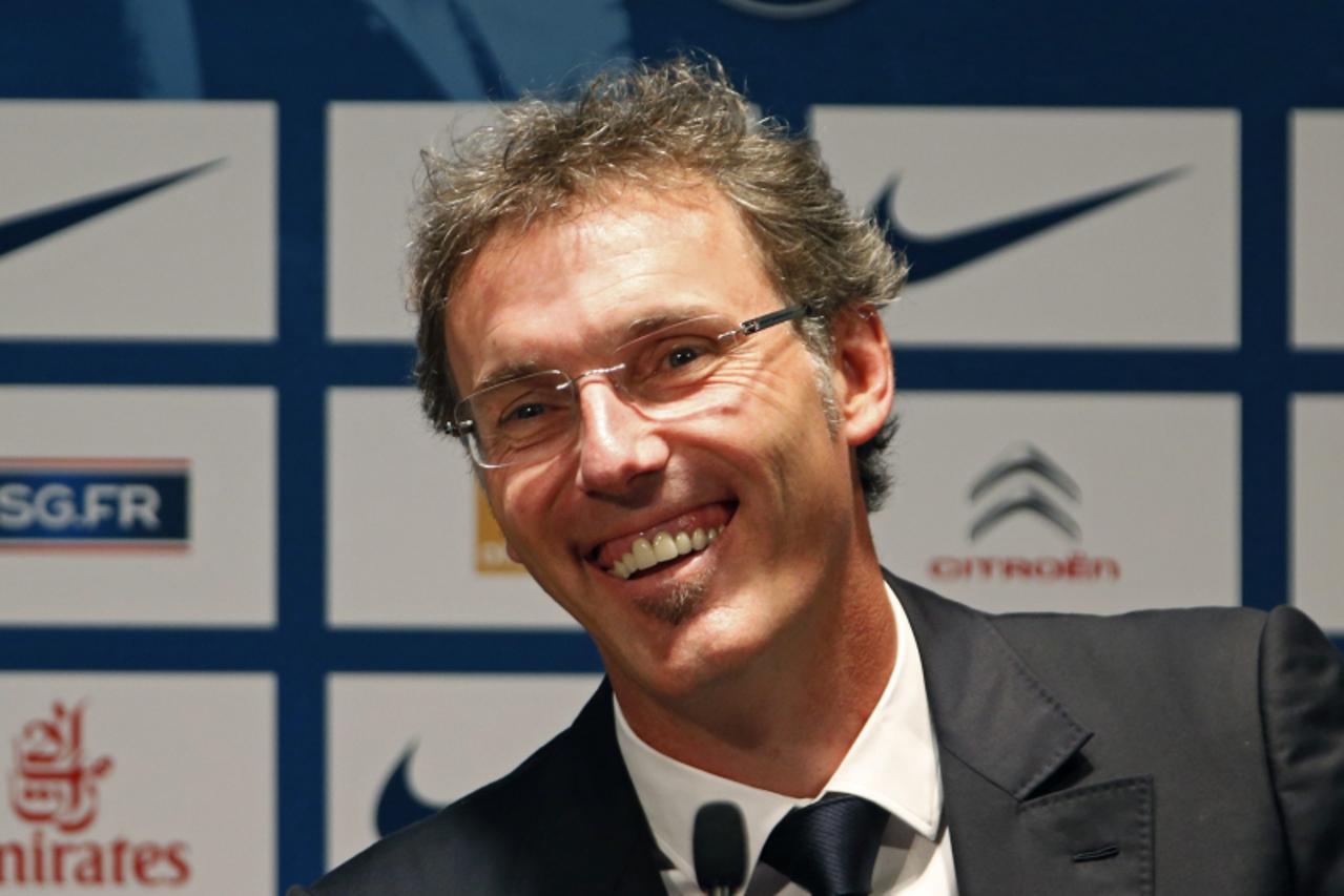 'Newly-named Paris St Germain soccer team coach Laurent Blanc attends a news conference at the Parc des Princes stadium in Paris June 27, 2013. Paris St Germain named Laurent Blanc as coach on a two-y