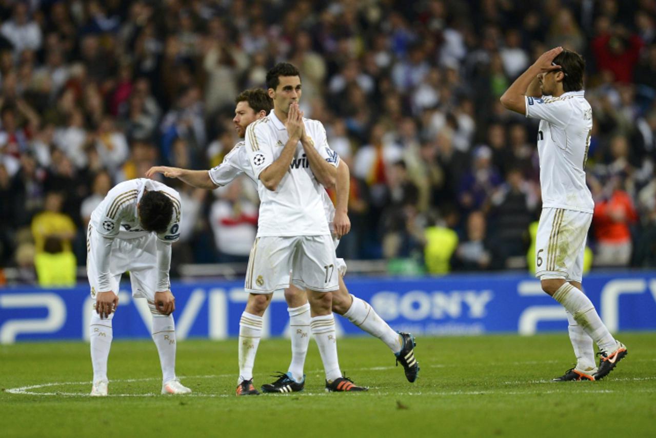 'Real Madrid\'s players react after the penalty shootout during their Champions League semi-final second leg soccer match against Bayern Munich at Santiago Bernabeu stadium in Madrid, April 25, 2012. 