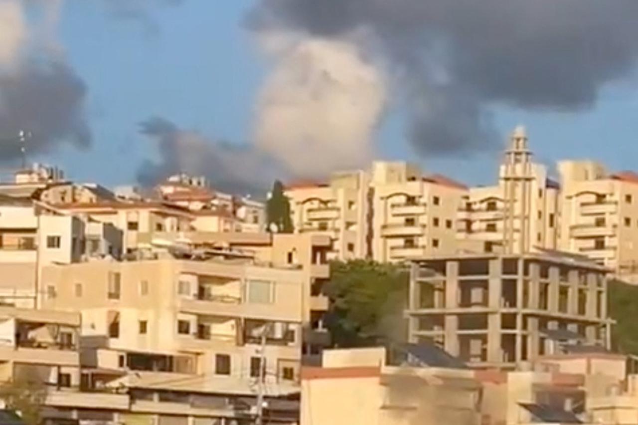 Smoke and fire are seen following an explosion in a building in Qennarit