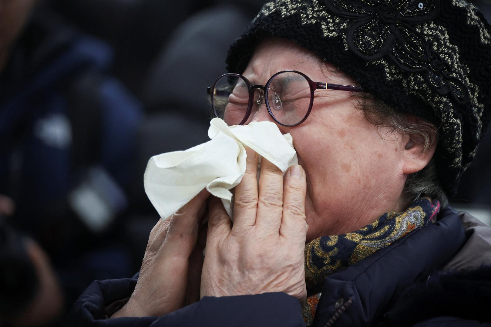 A relative of a passenger of the aircraft that crashed after it went off the runway, reacts at Muan International Airport, in Muan, South Korea, December 29, 2024. REUTERS/Kim Hong-Ji Photo: KIM HONG-JI/REUTERS