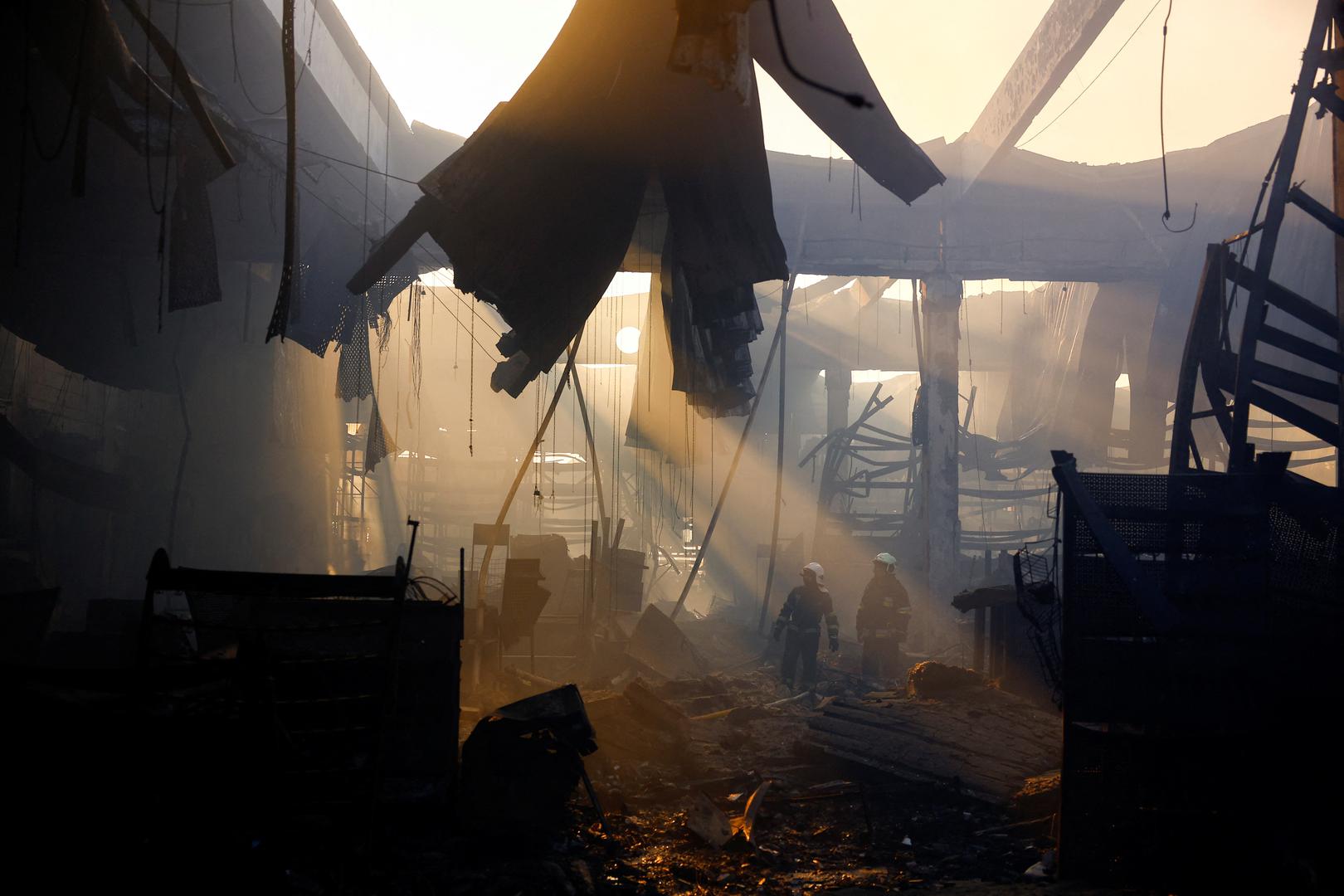 Firefighters work at the site of a household item shopping mall which was hit by a Russian air strike, amid Russia's attack on Ukraine, in Kharkiv, Ukraine, May 25, 2024. REUTERS/Valentyn Ogirenko Photo: VALENTYN OGIRENKO/REUTERS