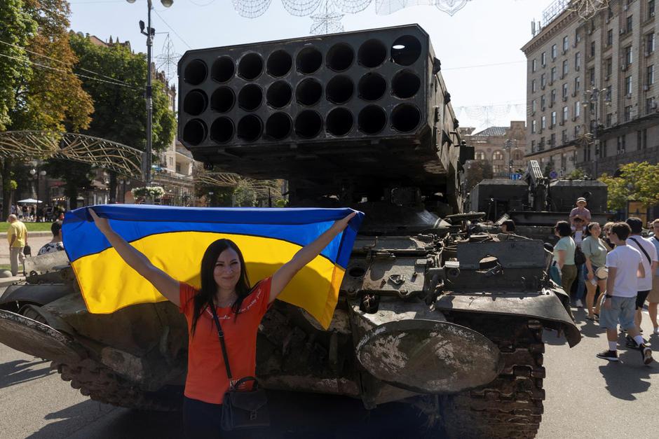 People visit an exhibition of destroyed Russian military vehicles and weapons in Kyiv