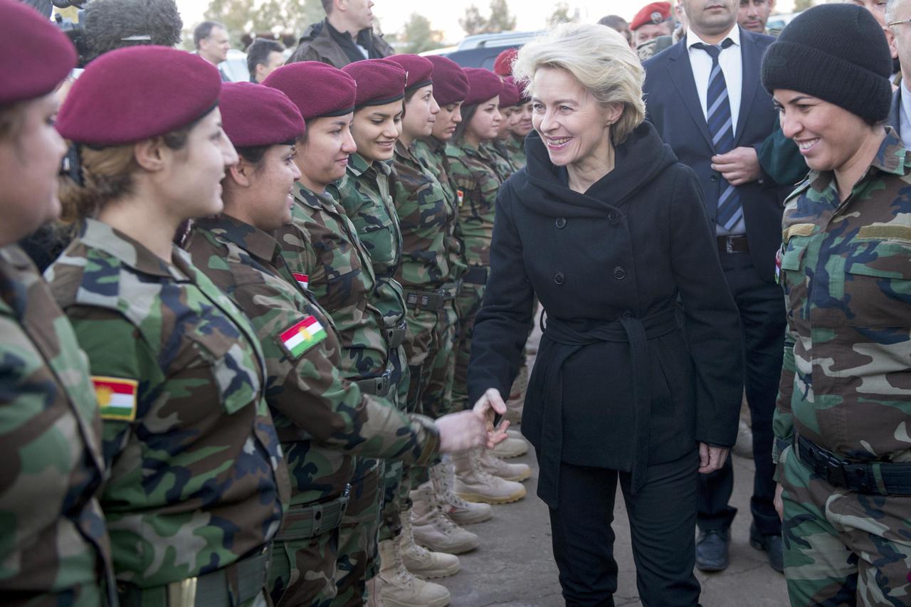 German Defence Minister Ursula von der Leyen (2nd R) greets Kurdish forces female recruits at the Zeravani Training Centre in Bnaslava near Arbil, north of Iraq January 12, 2015, who are being trained by the German armed forces, Bundeswehr.   REUTERS/Maur