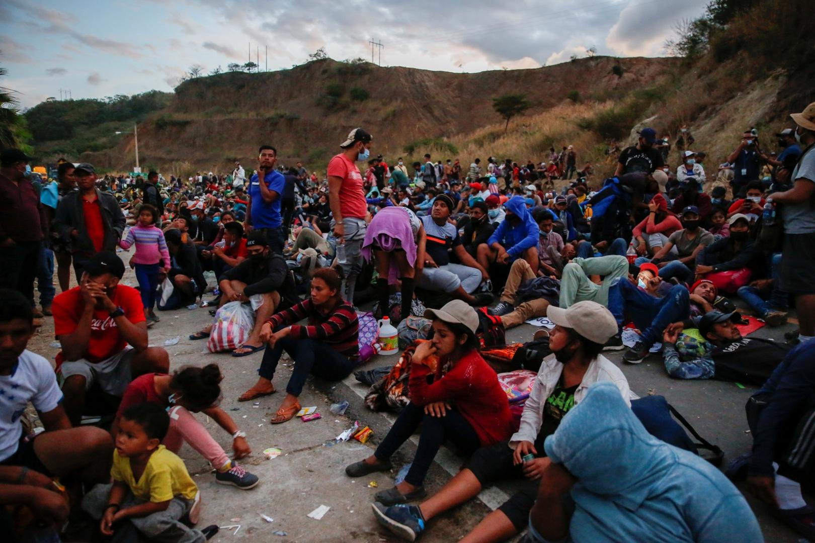 Hondurans take part in a new caravan of migrants, set to head to the United States, in Vado Hondo Hondurans taking part in a new caravan of migrants, set to head to the United States, rest on a road, in Vado Hondo, Guatemala January 17, 2021. REUTERS/Luis Echeverria LUIS ECHEVERRIA