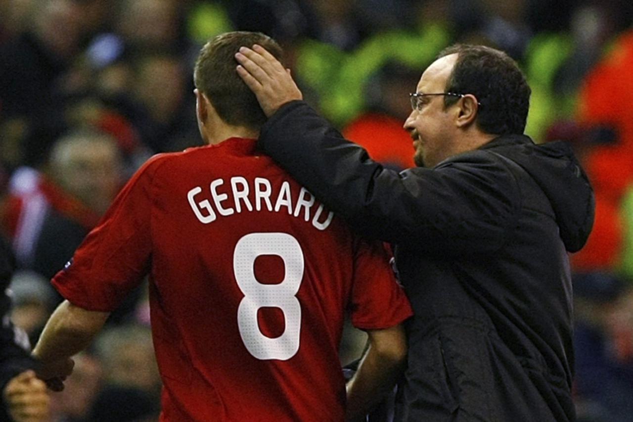 'Liverpool\'s coach Rafael Benitez (R) consoles captain Steven Gerrard after he walks off injured against Olympique Lyon during Champions League soccer match at Anfield in Liverpool, northern England,