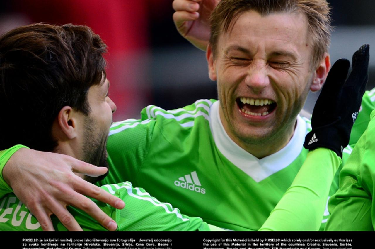 'Wolfsburg\'s Diego (L) gestures with Ivica Olic after he scores 1:0 during the match VfL Wolfsburg - 1.FC Nuernberg in the Volkswagen Arena in Wolfsburg, Germany, 31 March 2013.  PHOTO: PETER STEFFEN