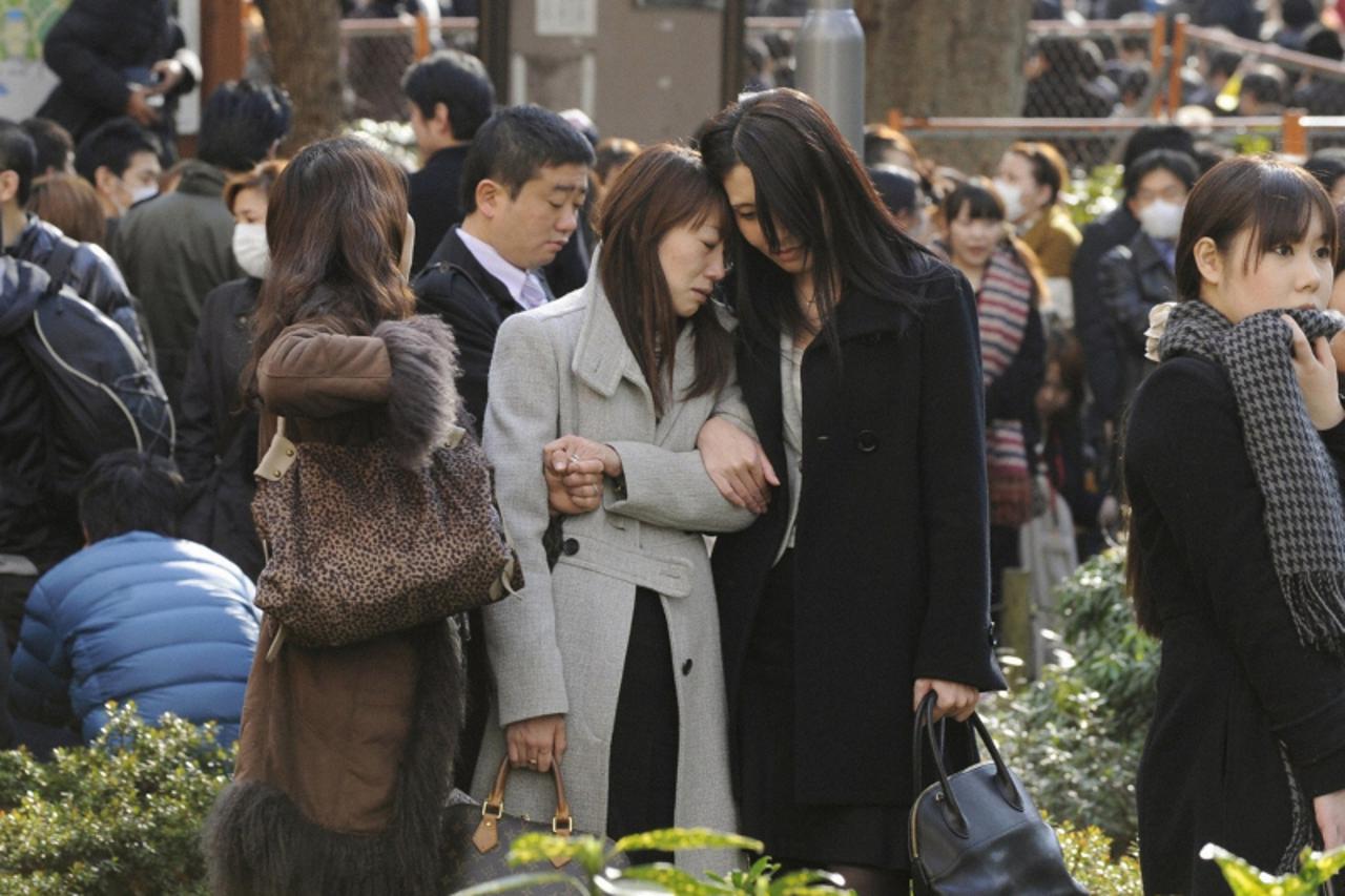 \'Evacuees stand around Shinjuku Central Park in Tokyo Japan March 11, 2011. A massive 8.9 magnitude quake hit northeast Japan on Friday, causing many injuries, fires and a ten-metre (33-ft) tsunami a